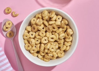 brown peanuts in white ceramic bowl