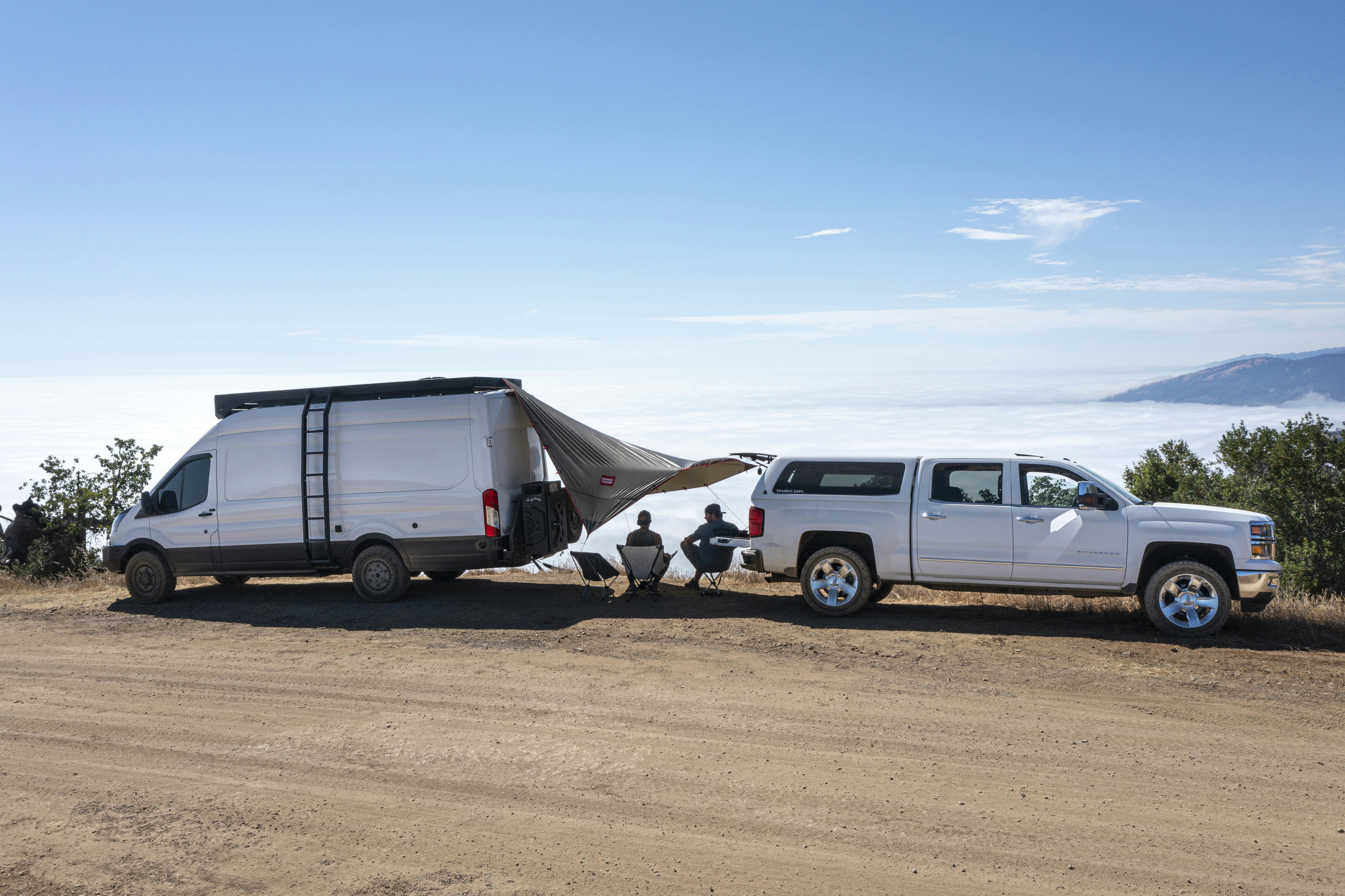 white van on brown sand during daytime