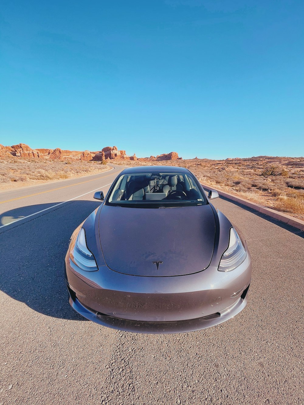 gray car on gray asphalt road during daytime