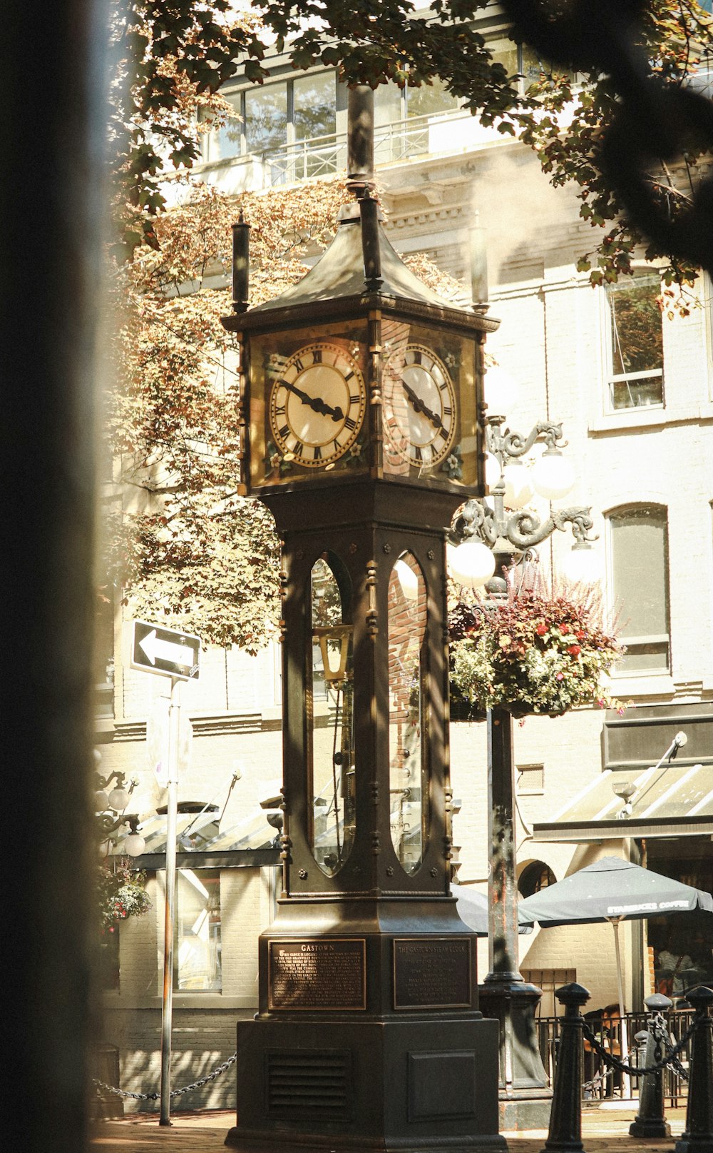 brown wooden analog clock at 10 00