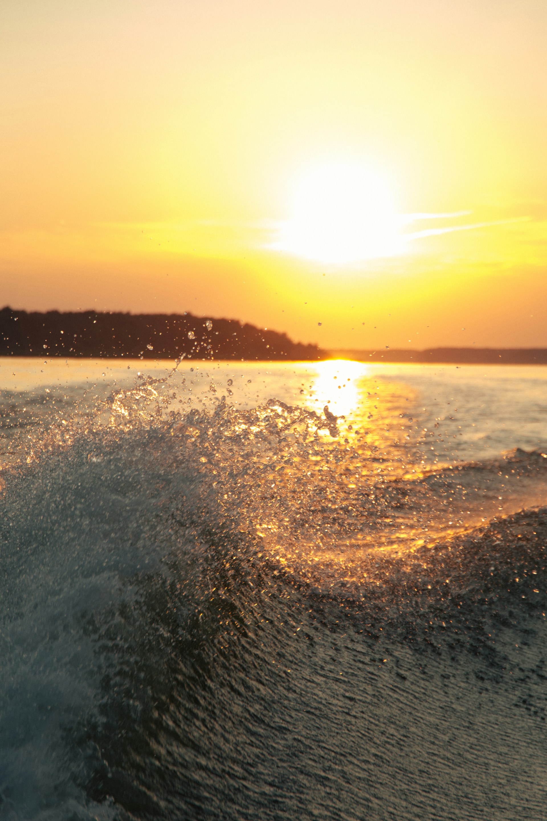 body of water during sunset