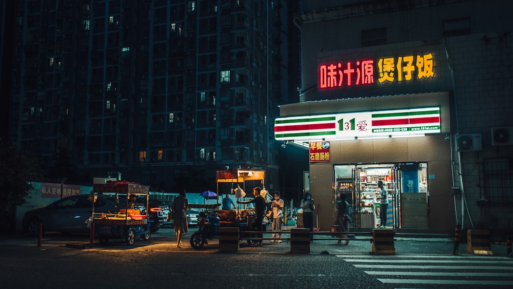 people walking on pedestrian lane during night time