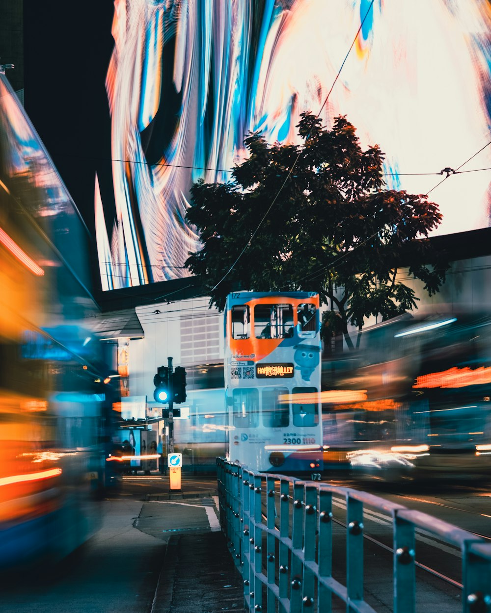 white bus on road during daytime