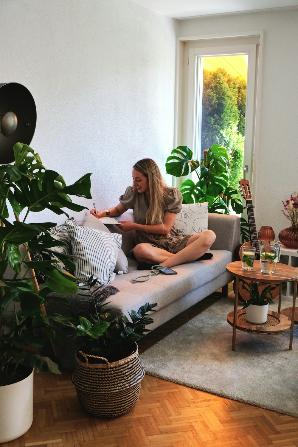 2 women sitting on couch