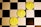 Three gold coins with the Ethereum logo and text are placed diagonally on a black and white checkerboard surface.