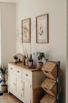 brown woven basket on white wooden cabinet