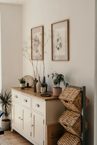 brown woven basket on white wooden cabinet