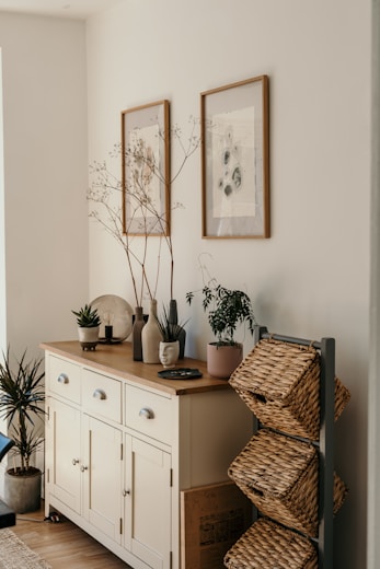 brown woven basket on white wooden cabinet