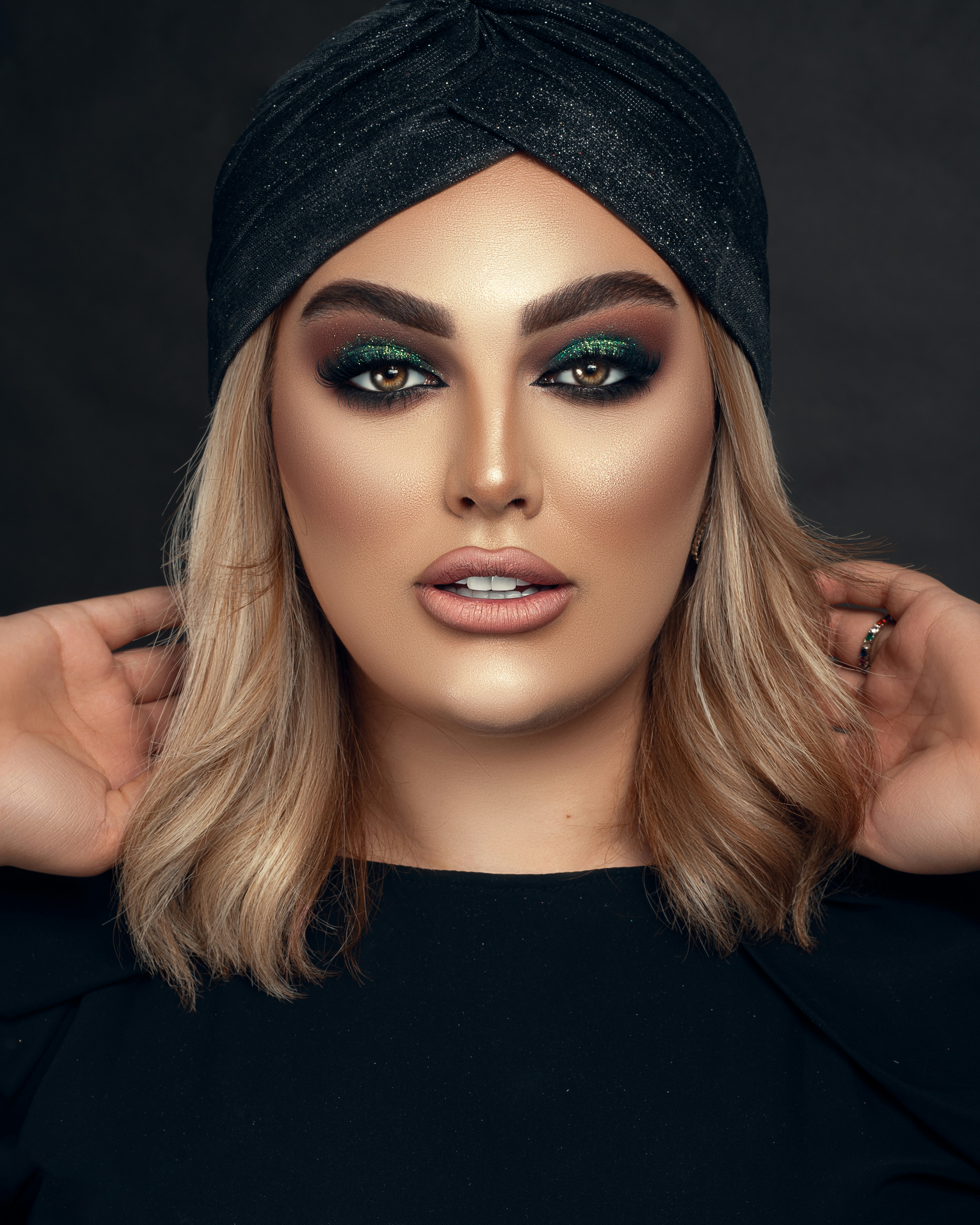 woman in black knit cap and black shirt