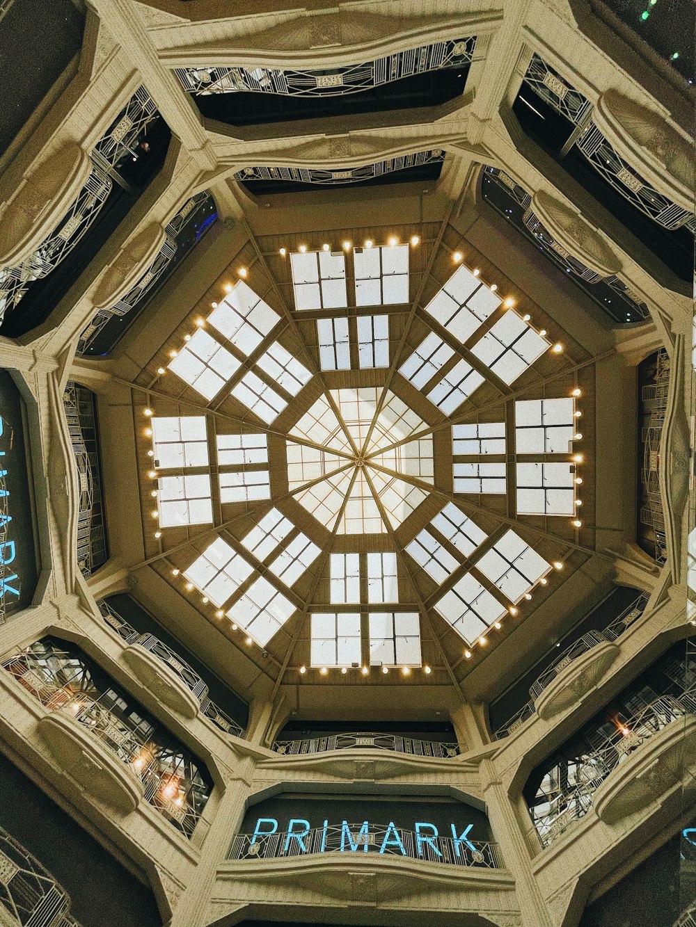 brown and white ceiling with glass windows