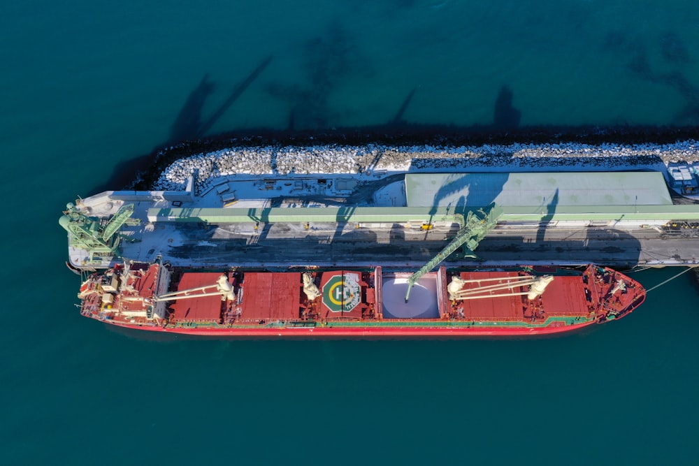 white and red ship on sea