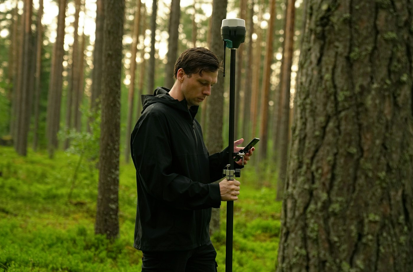 Surveyor working an open rural tract