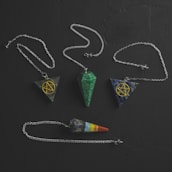 A collection of pendulums and tarot cards.