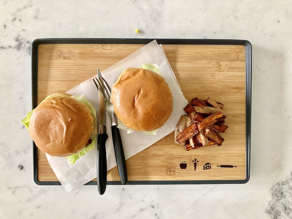 burger on brown wooden chopping board