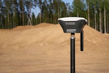 black and silver stand on brown sand