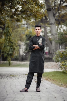 A patient walking confidently with custom foot orthotics in a sunny Istanbul park.
