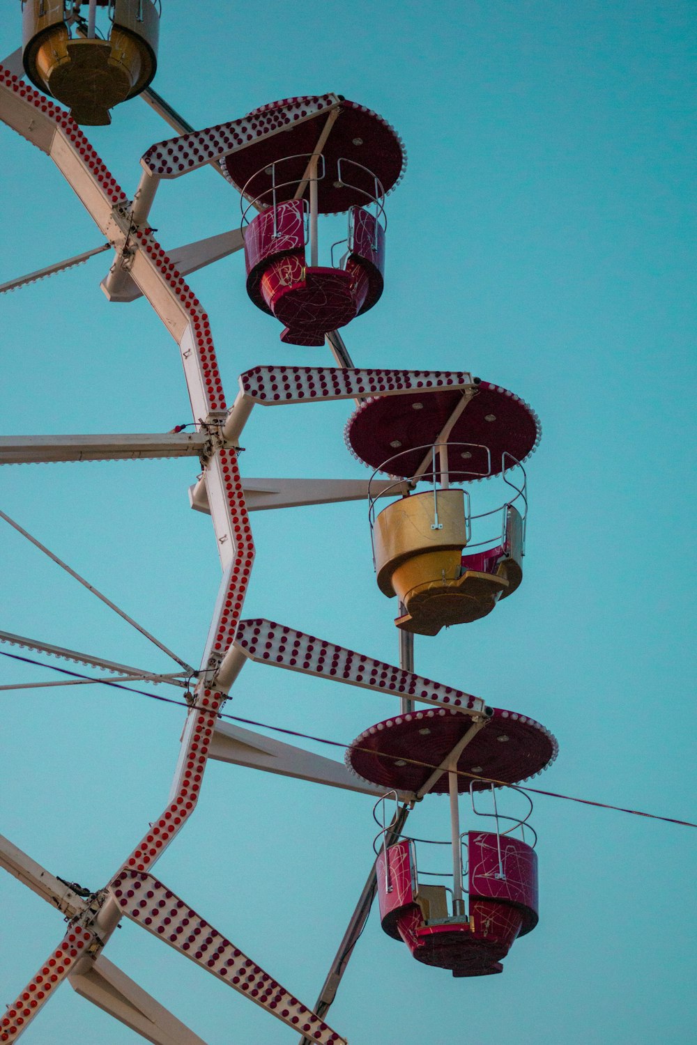 white and black ferris wheel under blue sky during daytime