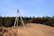 gray tripod on brown rock