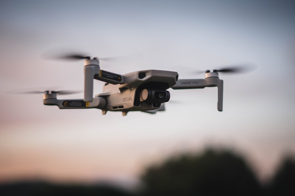 black and white drone in mid air