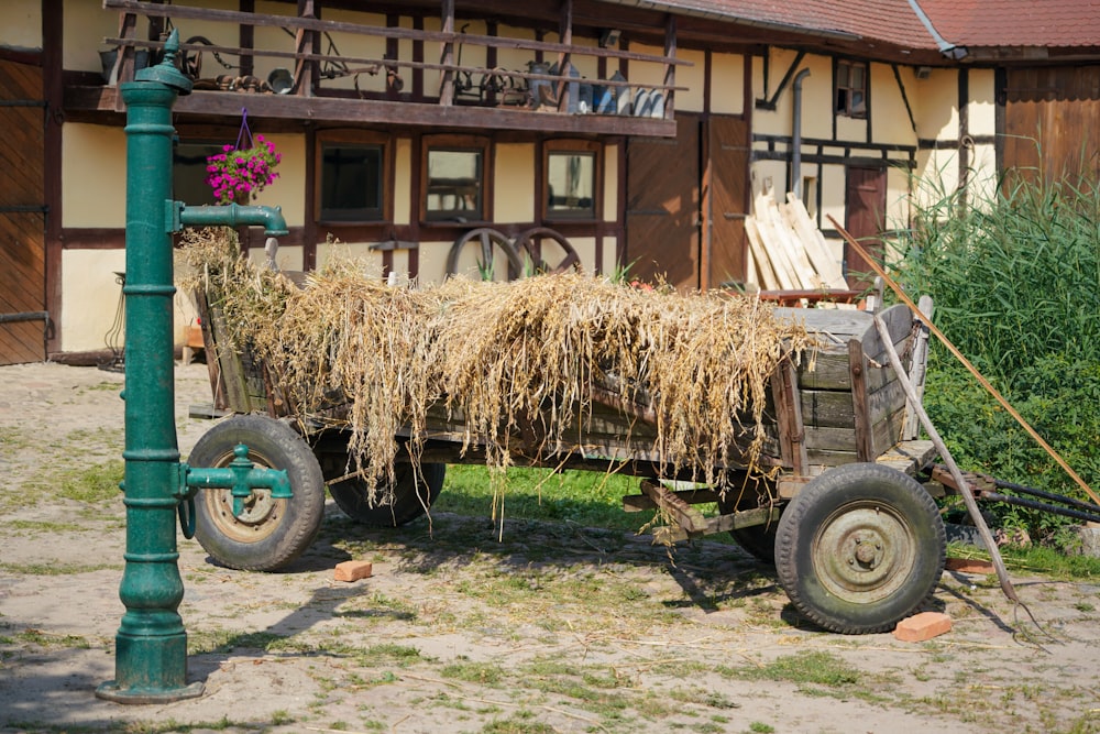 brown wooden cart with brown hays
