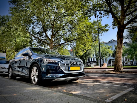 A sleek modern car parked on a sunny Marrakech street.
