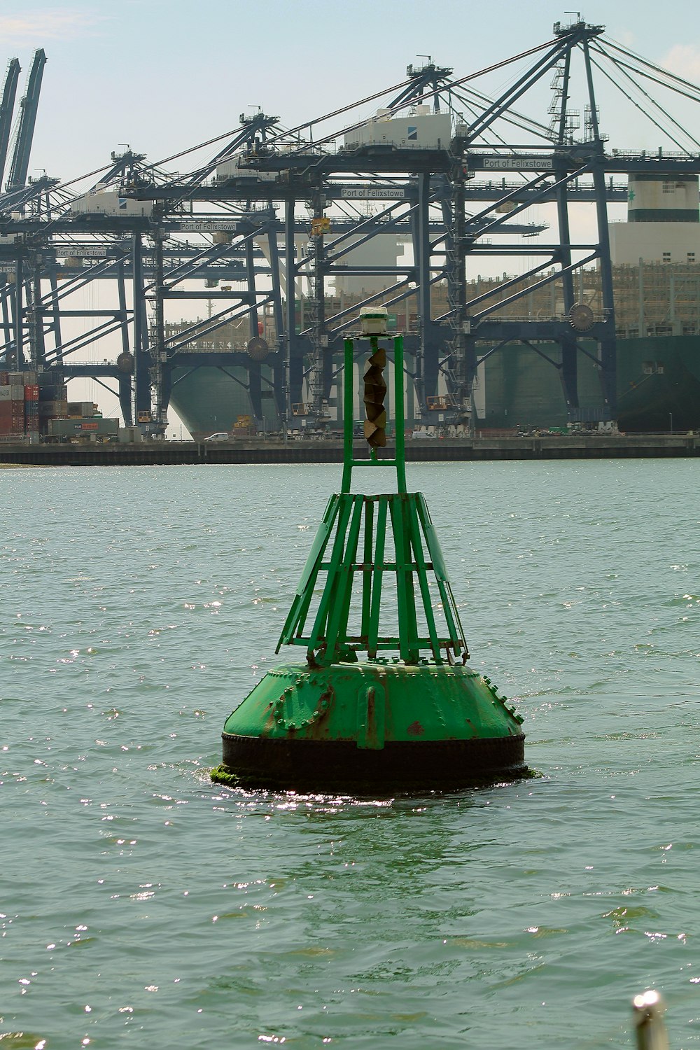 green and red boat on water