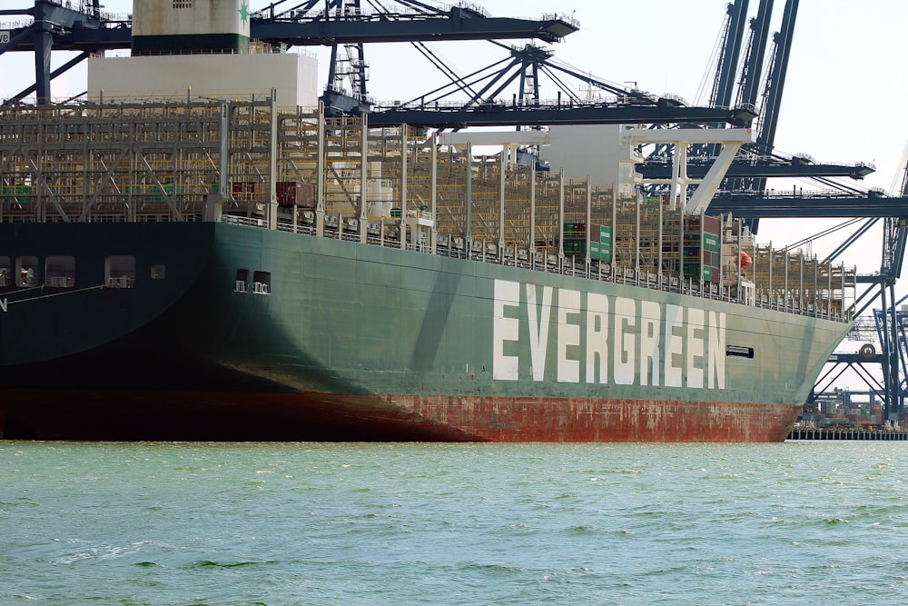 black and red cargo ship on sea during daytime