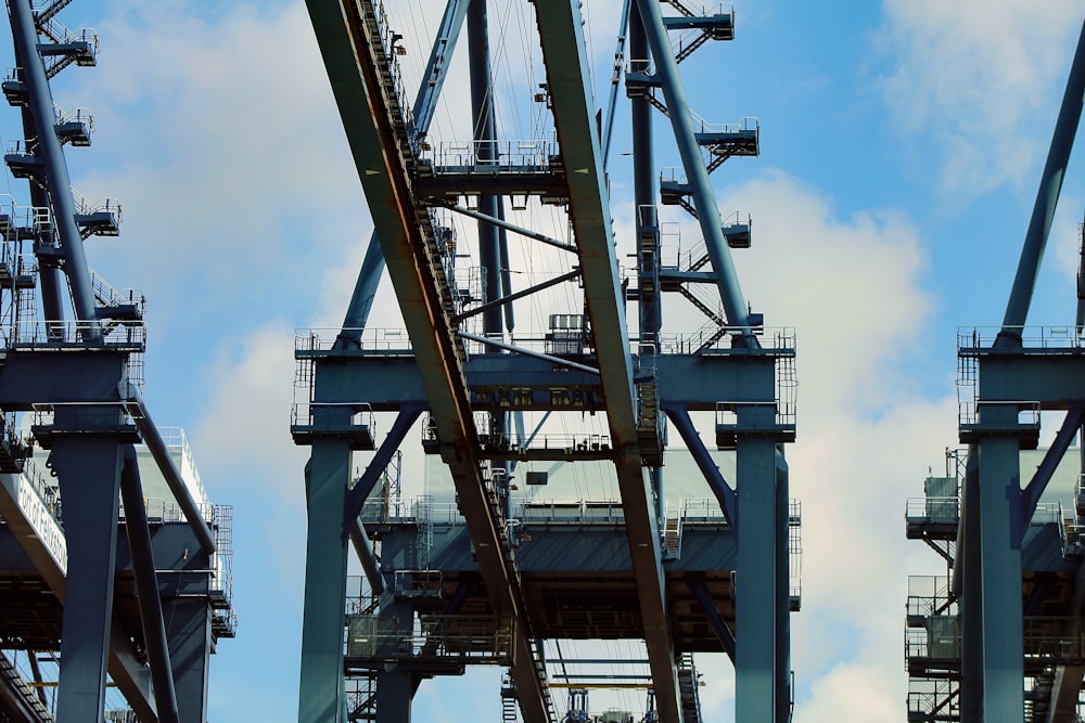 white and brown metal crane under blue sky during daytime