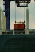 red and black ship on body of water during daytime