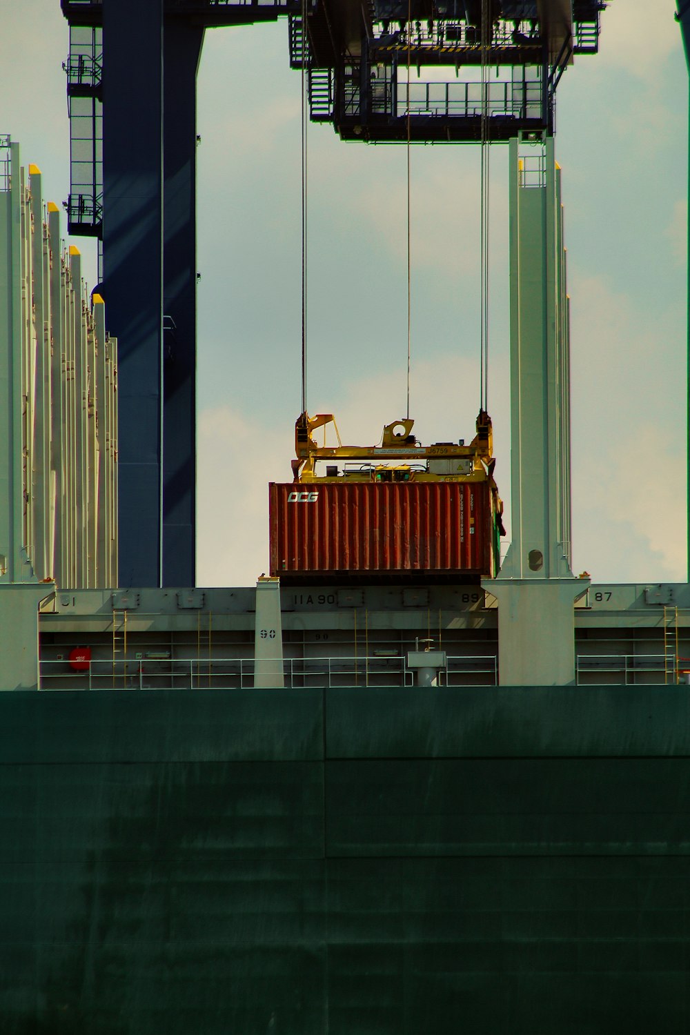 red and black ship on body of water during daytime