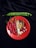A vibrant arrangement of fresh ingredients is displayed on a red plate, including red chili peppers, smoked fish, garlic, and shallots. Positioned above on a black background is a long, green bean pod.