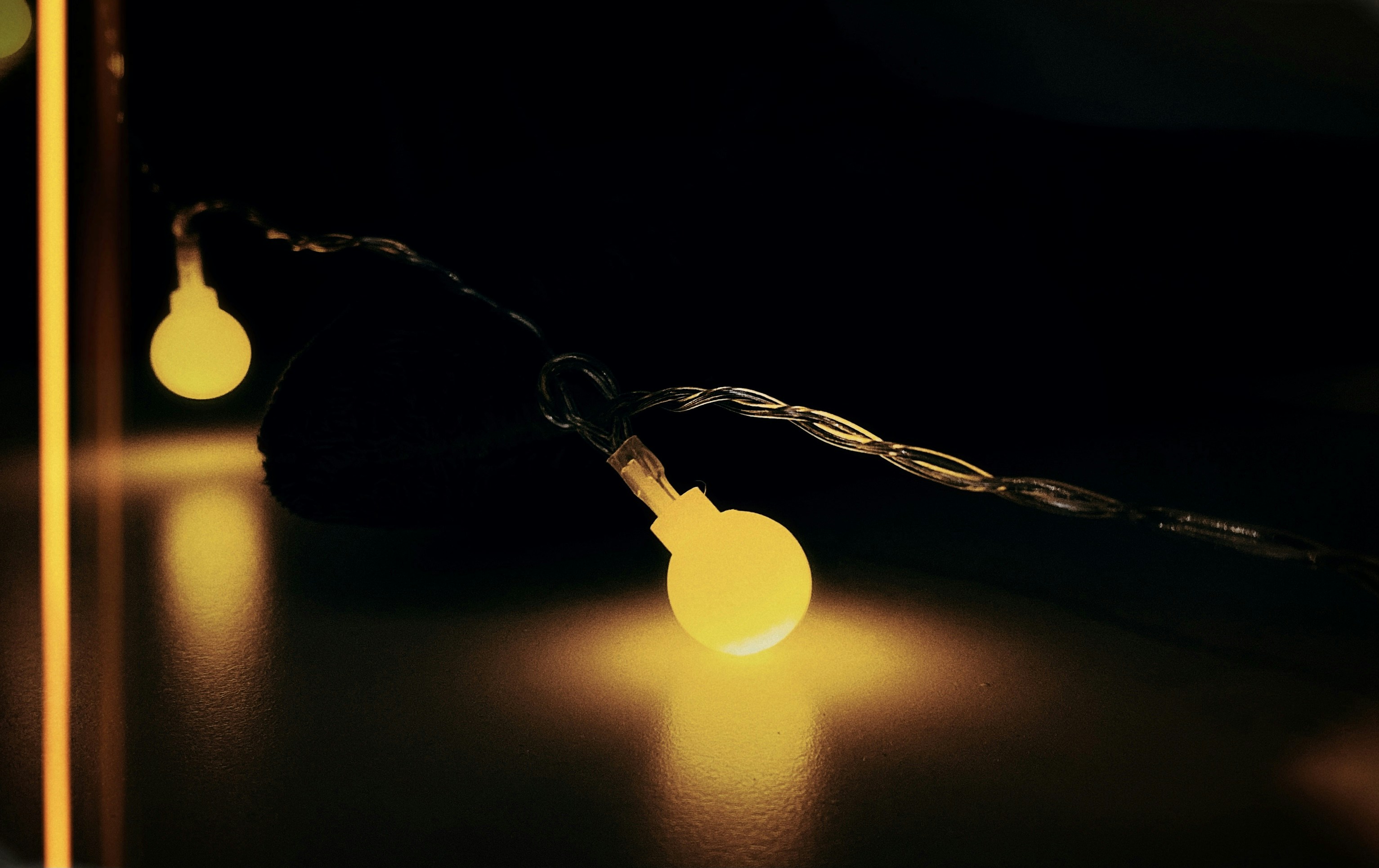 silver heart pendant necklace on black textile