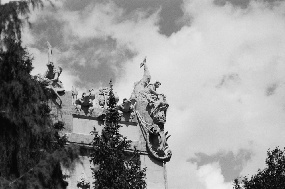 grayscale photo of statue of man riding horse