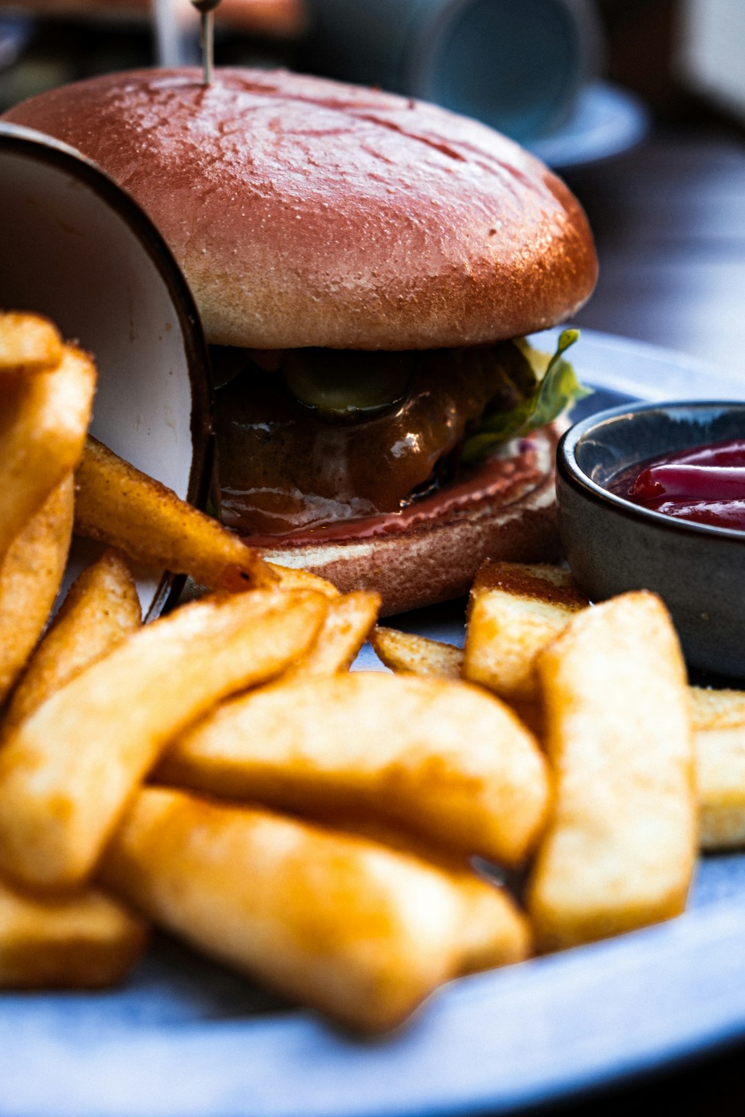 burger and fries on black tray