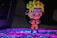 Close-up of a vibrant anime figure from the Jujutsu Kaisen collection glowing under neon lights.
