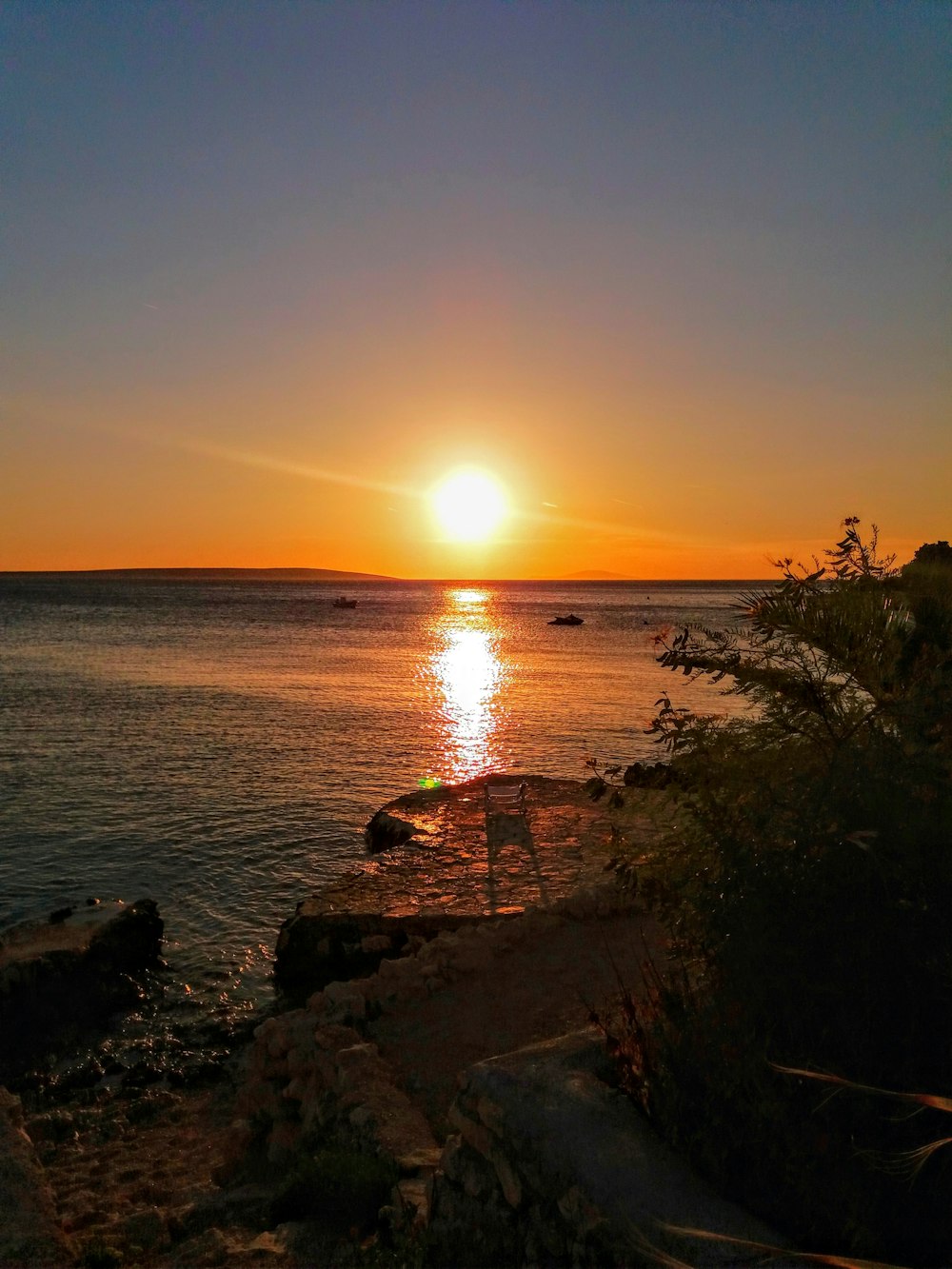 body of water during sunset