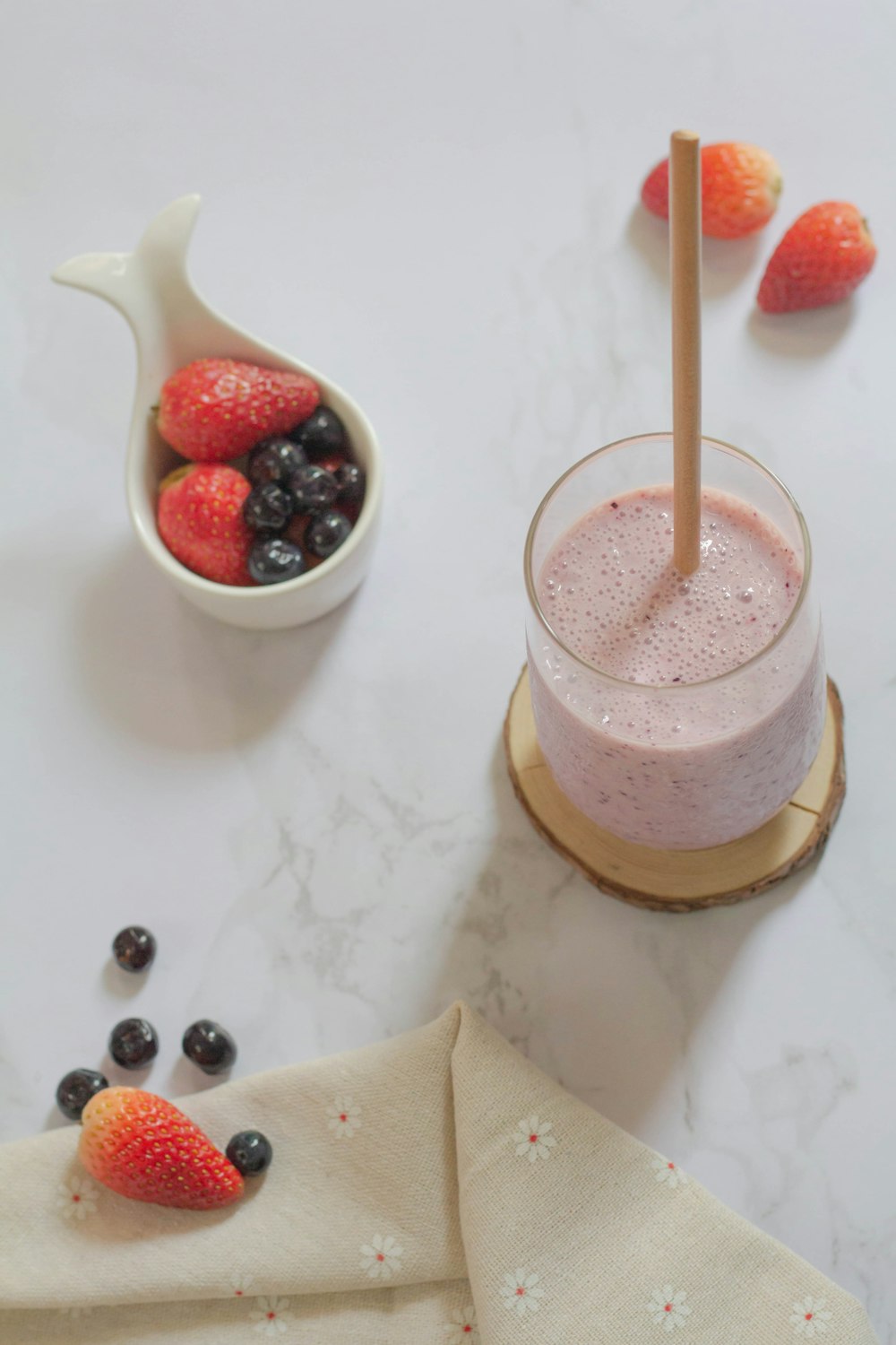 clear glass cup with strawberry shake