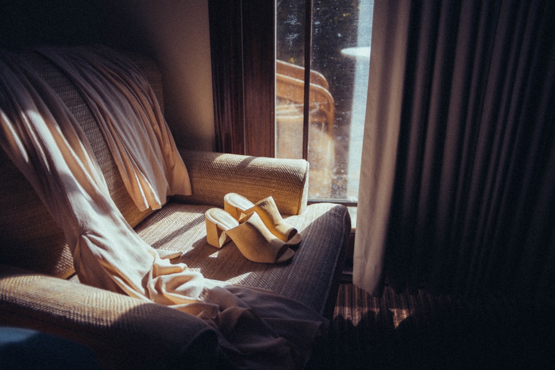 white textile on gray couch