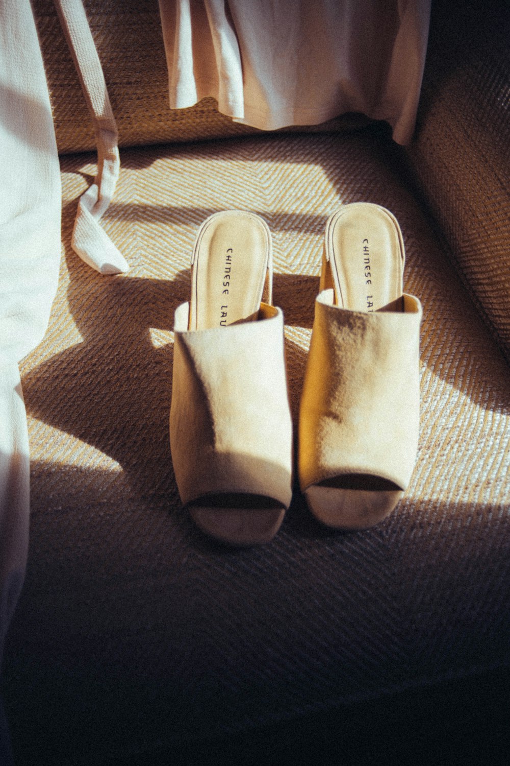 brown and white slide sandals