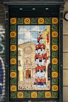 A vibrant gathering of Penya Blaugrana Tamuda Tetuan members celebrating in front of a colorful mural featuring FC Barcelona colors.