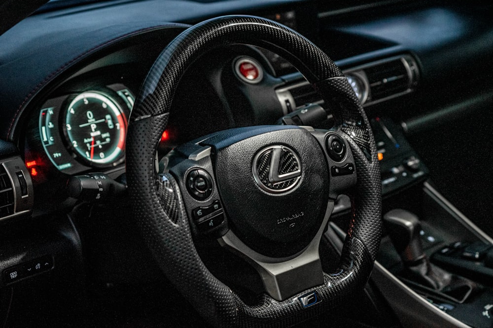 black and gray nissan steering wheel