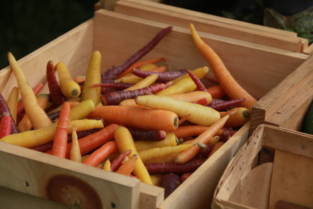 orange carrots on brown cardboard box