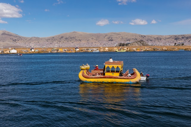 yellow and brown boat on sea during daytime