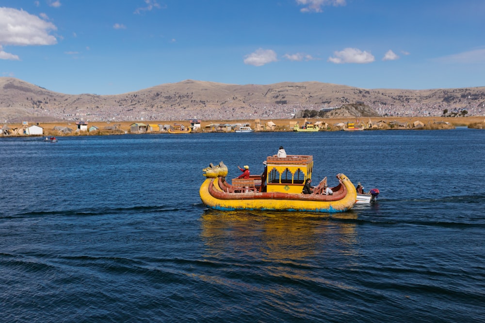 yellow and brown boat on sea during daytime