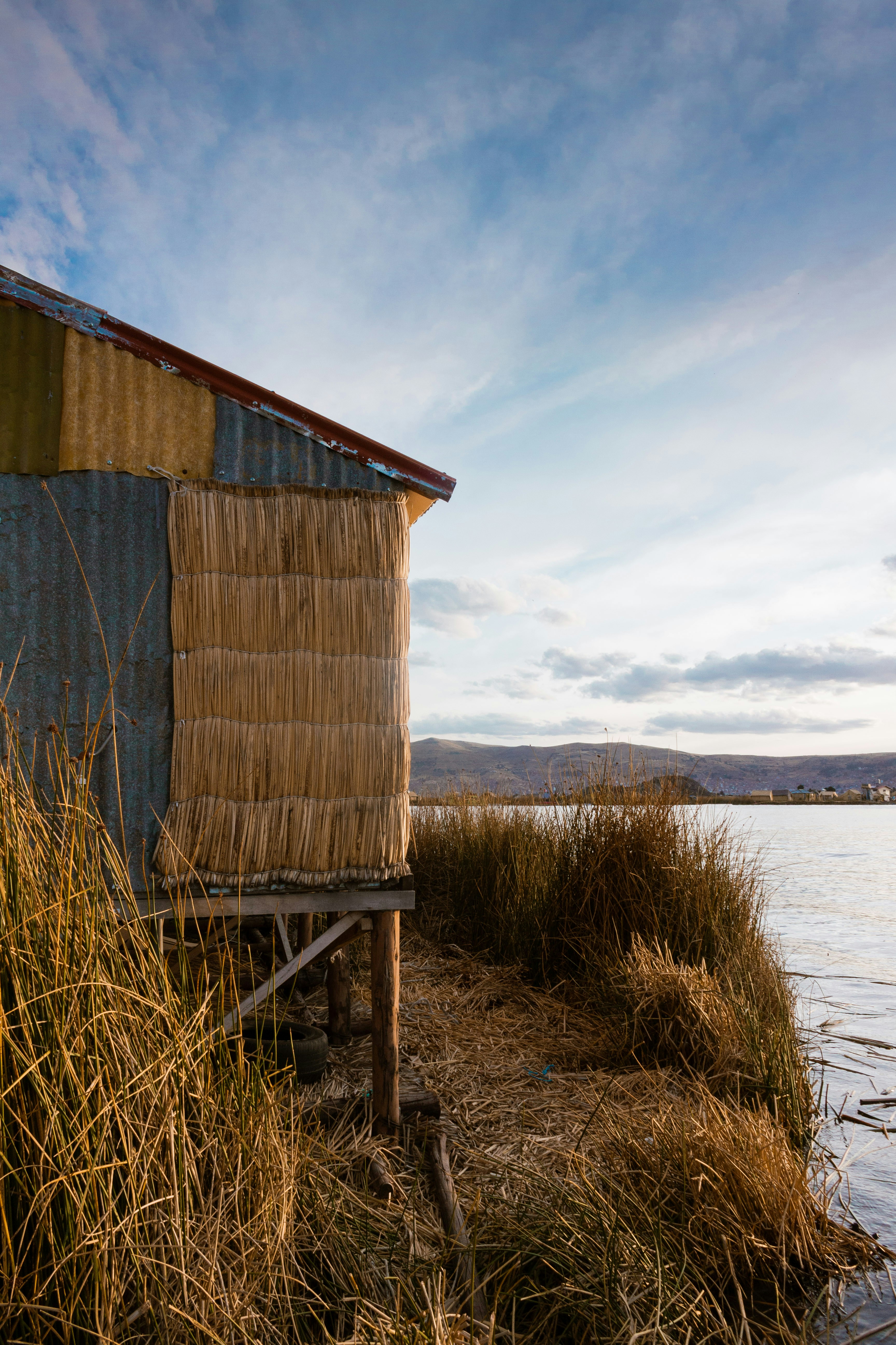 Brown wooden house near body of water during daytime photo – Free ...