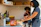 Smiling mother-to-be preparing a colorful healthy meal in the kitchen