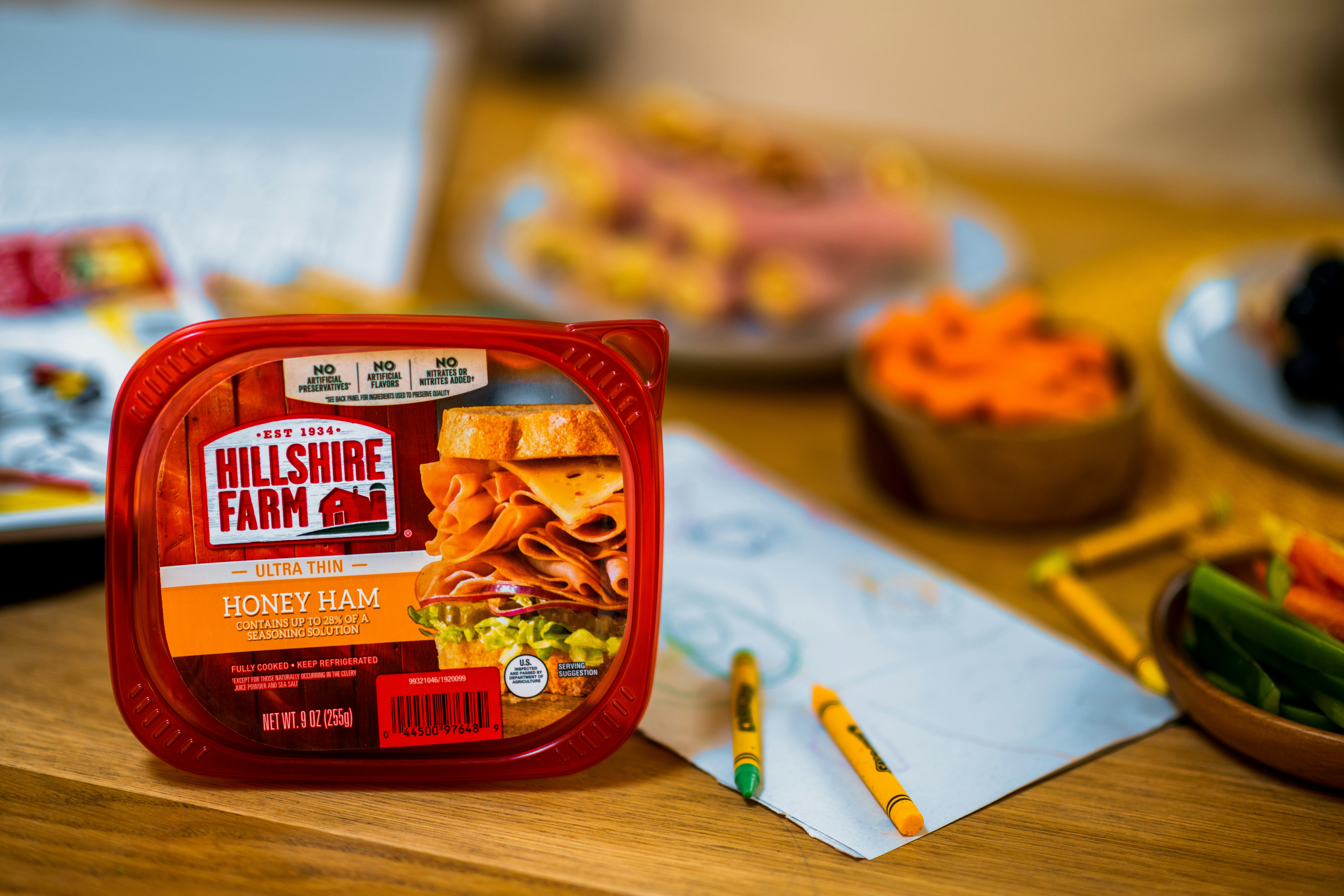 red and yellow plastic pack on brown wooden table