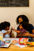 A joyful family sharing Nutri Picks snacks around a festive table, capturing warmth and togetherness.