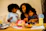 Family sharing a meal featuring ginguba products, smiling and enjoying together.