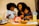 A happy family enjoying a meal together with fresh ingredients.